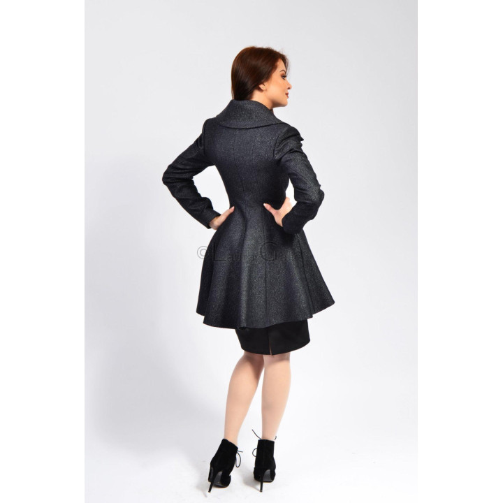 Back view of the Inez 2 coat showing its fitted waist and flared hem