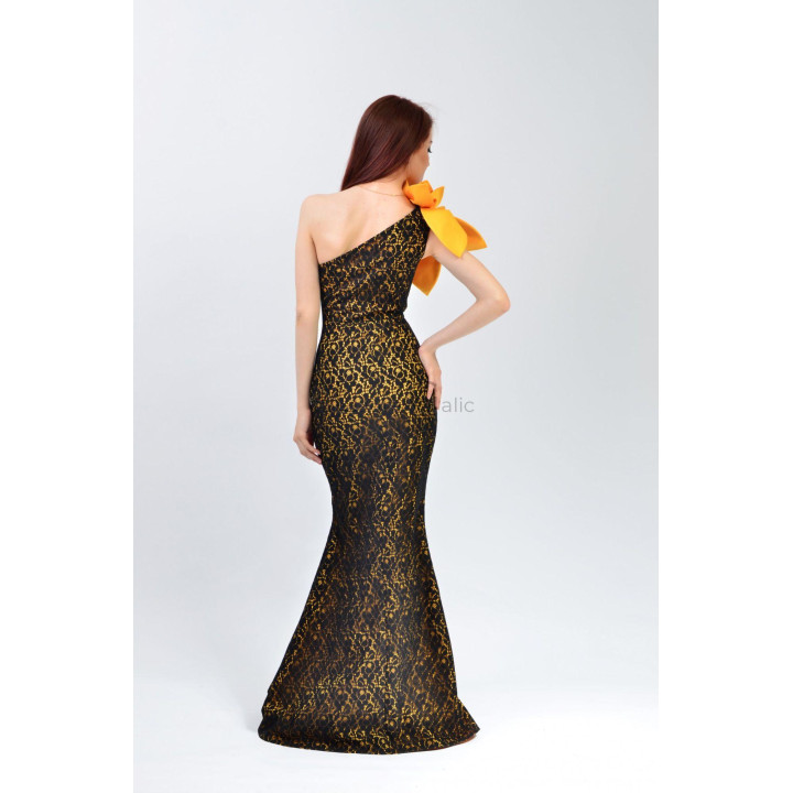 Back view of the Izaura 3 dress showing its one-shoulder neckline and flared hem