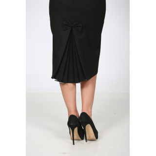 Close-up of the bow and decorative pleats on the black Cornelia skirt