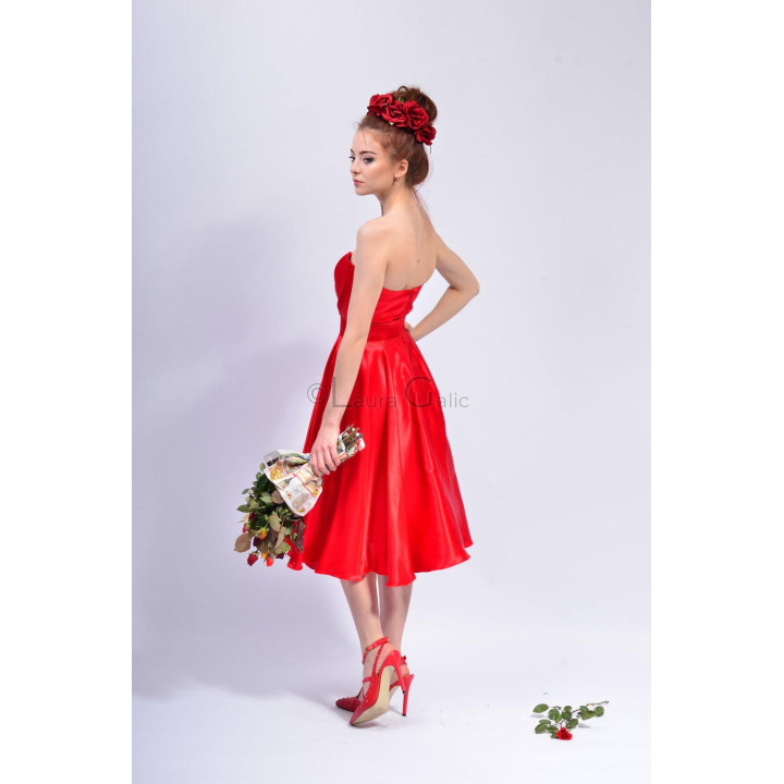 Back and side view of the red Alma 5 dress, showing its strapless bodice and flared skirt