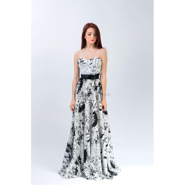 Full-length Olimpia evening gown with a strapless bodice and black and white floral skirt