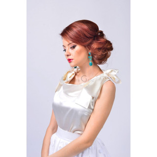 Close-up of the ivory Letitia 3 blouse with a draped neckline and oversized shoulder bow
