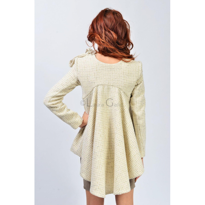 Back view of the Cora 2 coat with a long, flared central panel