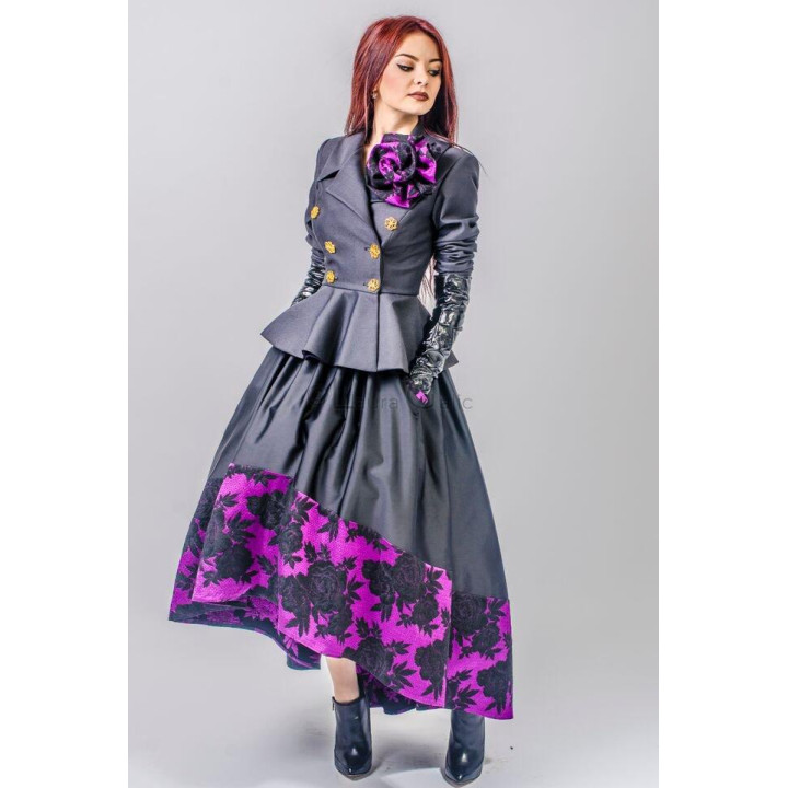 Front view of the Carolina 2 skirt with a voluminous shape and fuchsia floral border, styled with a grey jacket