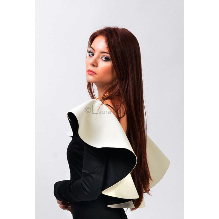 Close-up of the oversized ivory ruffle on the shoulder of the black Tereza dress