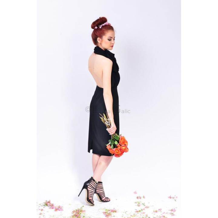 Back view of the Celeste dress showing its open back and halter neckline
