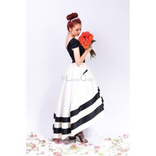 Back view of the full white Carolina skirt with two wide black bands at the hem