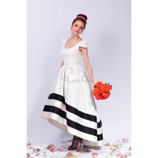 Cosmina bridal dress with a full white skirt and black bands at the hem