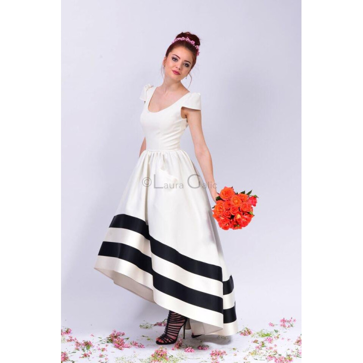 Cosmina bridal dress with a full white skirt and black bands at the hem