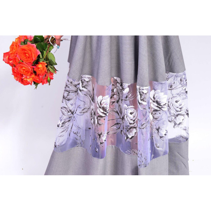 Close-up of the Erica dress skirt with a sheer lilac floral panel