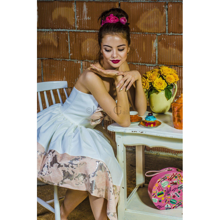 Close-up of the Ambra dress's strapless bodice and pleated skirt