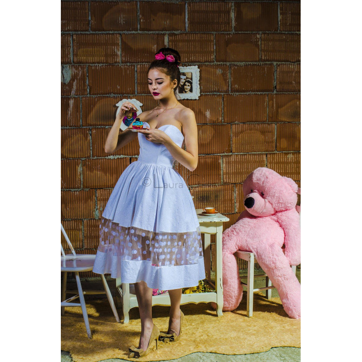Erica 3 dress showing its fitted strapless bodice and sheer polka-dot skirt detail