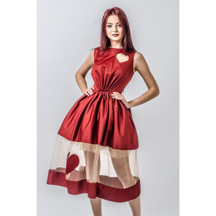 Close view of the Julia dress's heart-shaped cut-out and full red skirt
