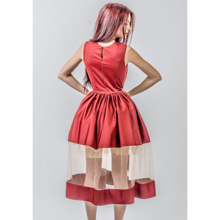 Back of the Julia dress with a zipper and sheer overlay over the red skirt