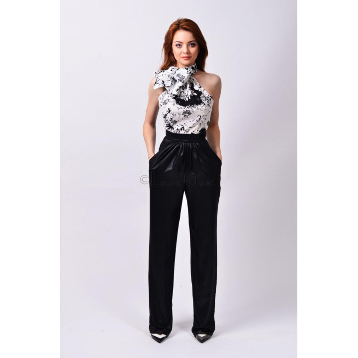 Front view of the Paula blouse in a black-and-white floral print with bare shoulders