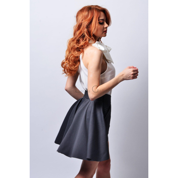 Back view of Lia 2 with a full draped panel and pleated skirt-like shape