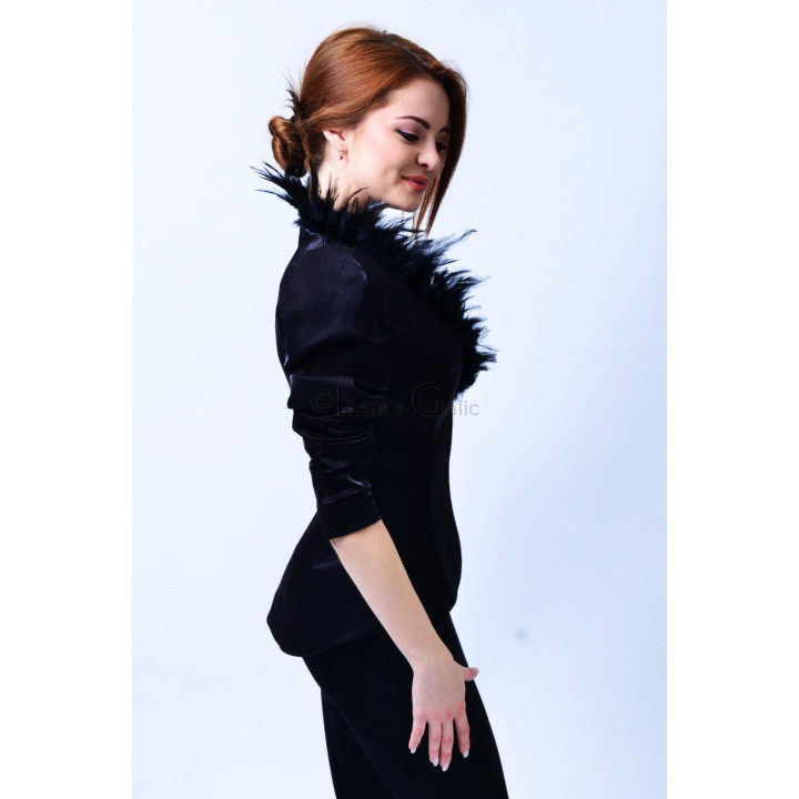 Side view of the Celia Couture blazer, showing its black feather trim and three-quarter sleeve