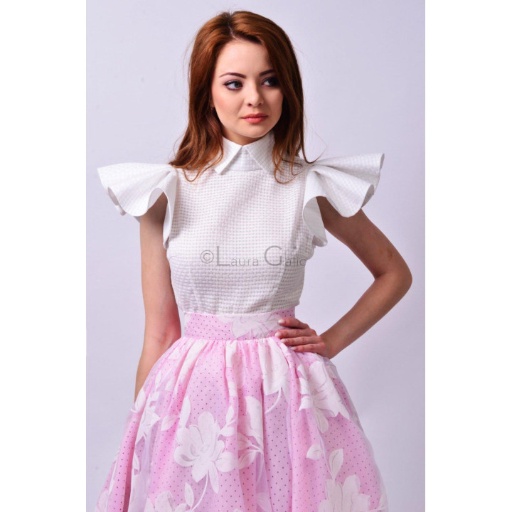 Close detail of the Dalma a skirt's high waistband and white floral print with small dots