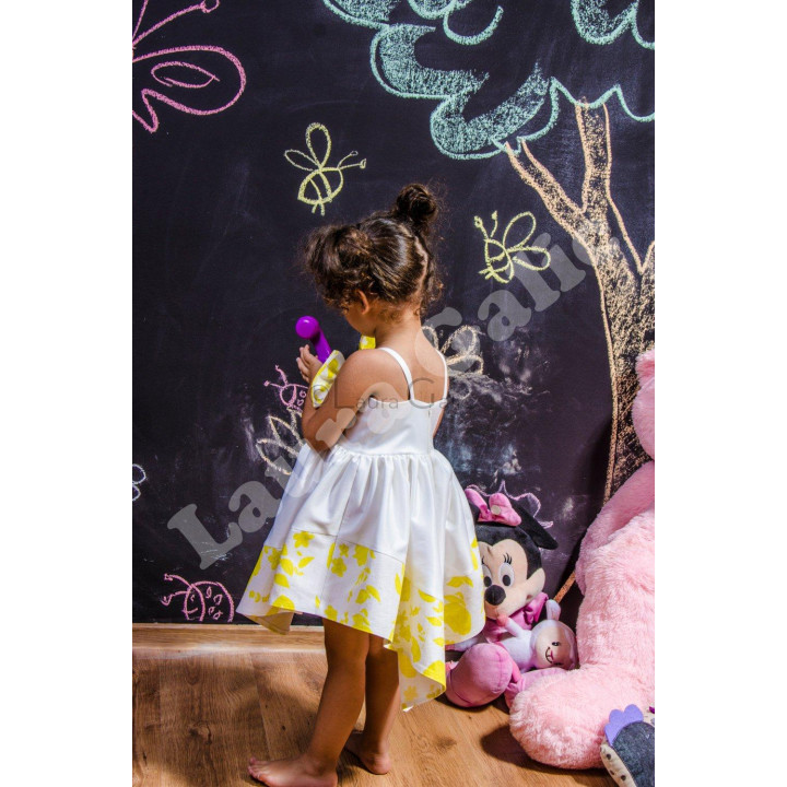 Back view of the Mini Ambra Dress with slim straps and a full skirt