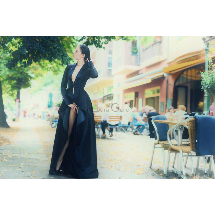 Gia long coat worn open with a defined waist and extended silhouette