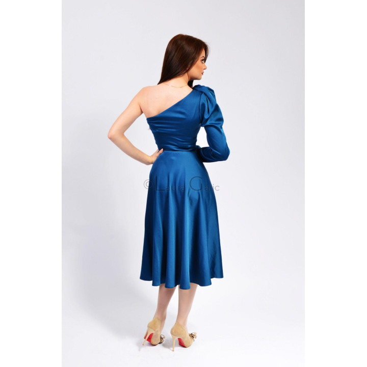 Back view of the Tatiana blue dress showing its asymmetric neckline and flared skirt