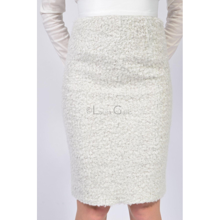 Close-up of the short-pile texture on the ivory pencil skirt
