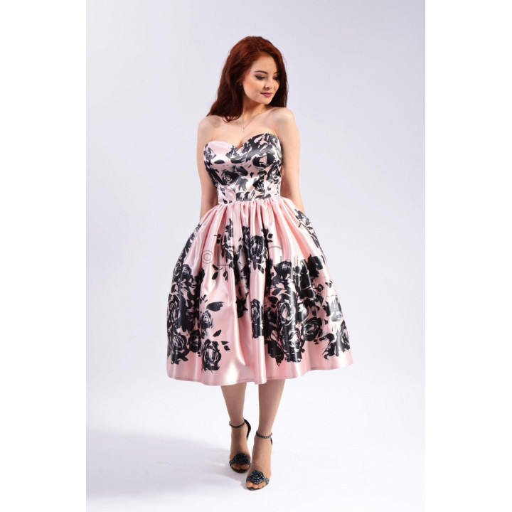 Dalma Midi Dress with a full skirt and black floral print on a blush-pink background