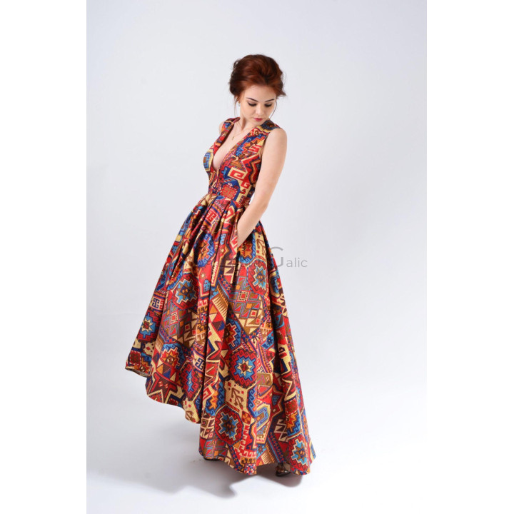 Angela 3 dress with a deep V-neck and long pleated skirt