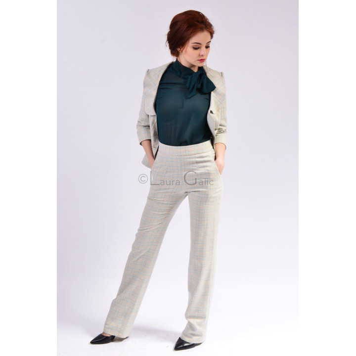 Henrietta suit styled with the jacket open and high-waisted trousers