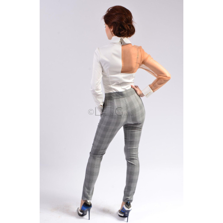 Back view of the Calina shirt showing its nude sheer panel and white sleeve