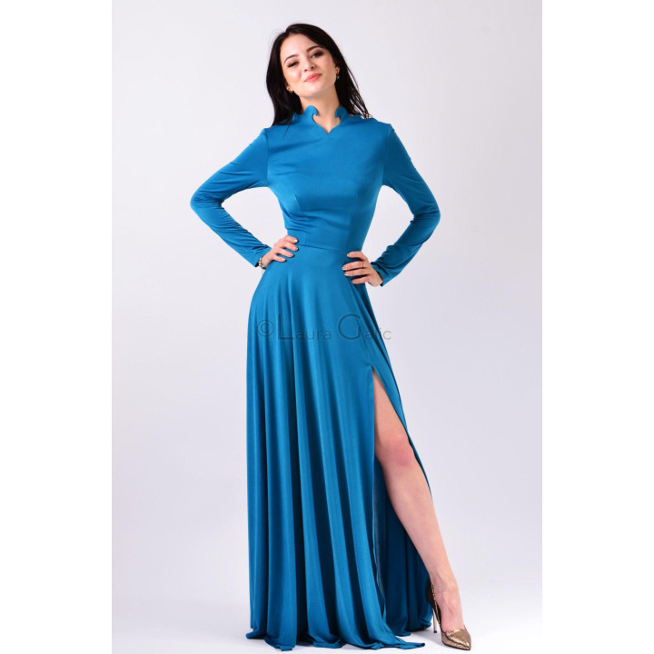 Front view of the blue Fatma long gown with long sleeves and a side slit