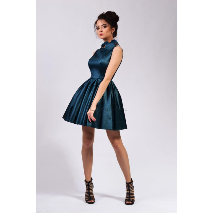 Side view of the Sasha dress showing its sculptural collar and short full skirt