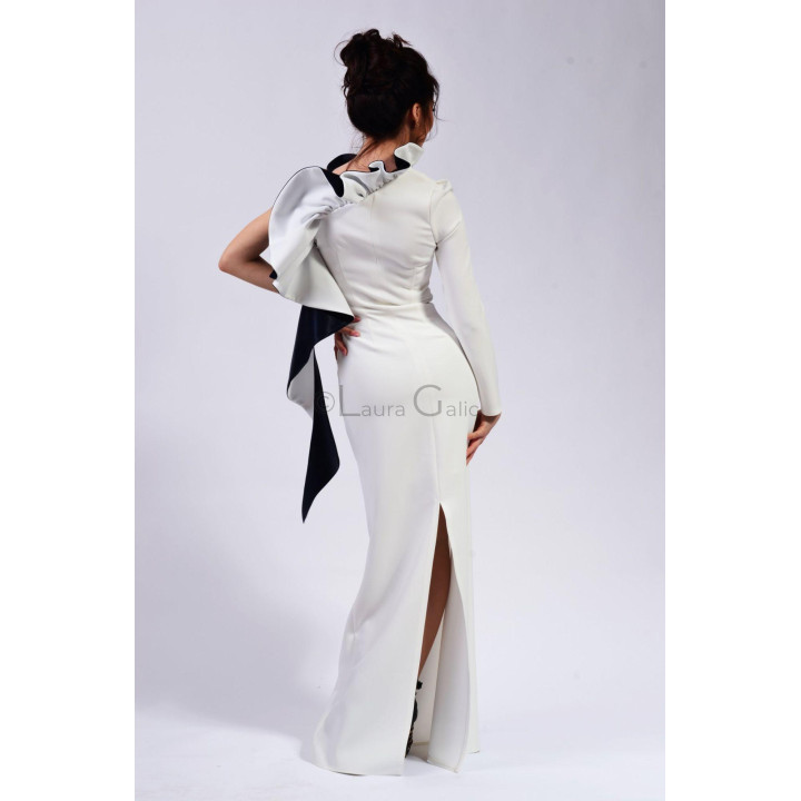 Rear view of the Gloria wedding dress with a back slit and contrasting shoulder ruffles