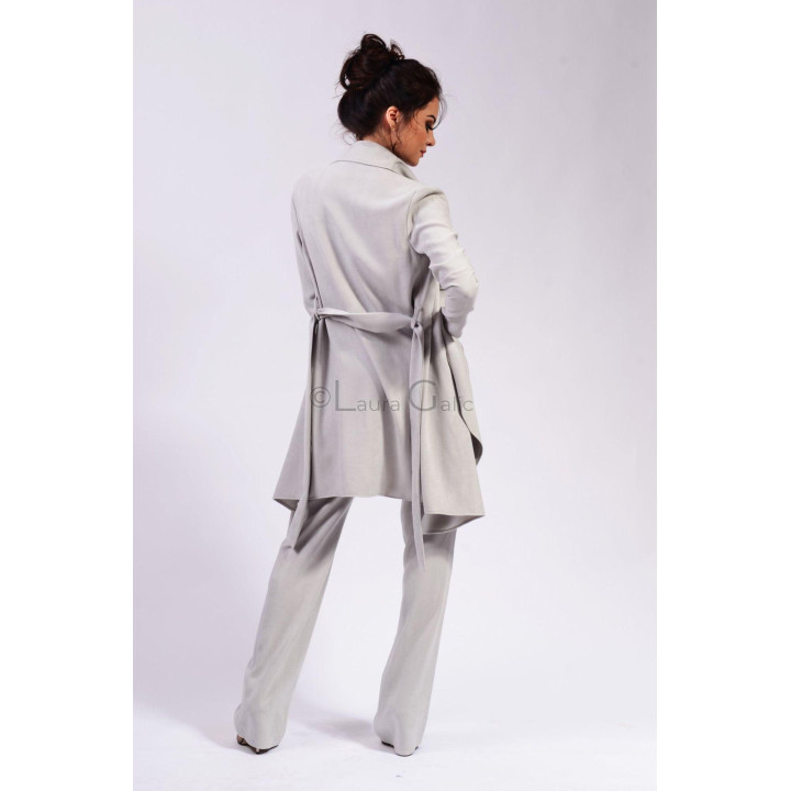 Back view of the long Demetra cardigan with its waist tie fastened at the back