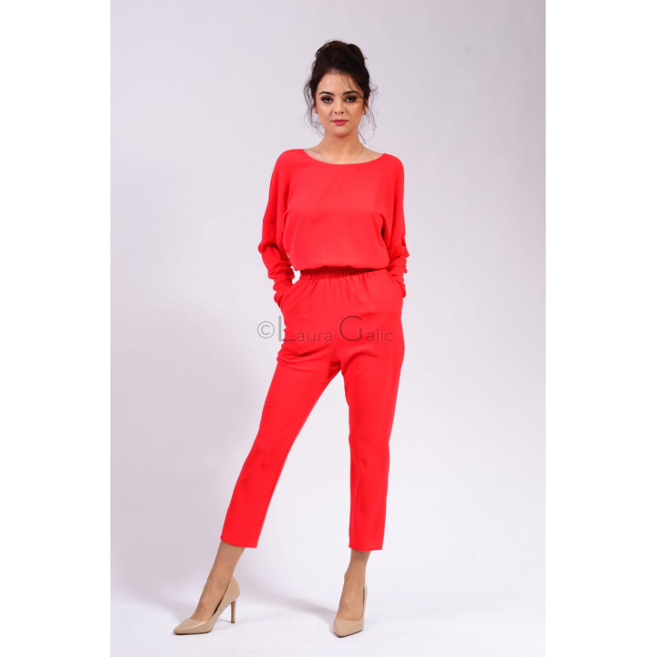 Front view of the Petra red jumpsuit with a boat neckline and elasticated waist