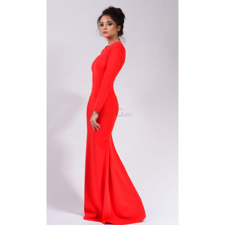 Side view of the red Mercedes gown showing its fitted silhouette and flared hem