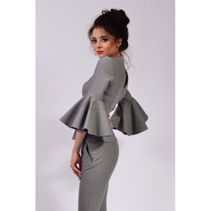 Back view of the grey Ioana blouse with fitted shaping and wide flared sleeves