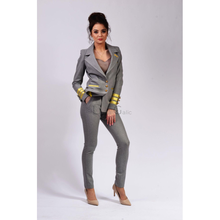 Ramona 3 women's jacket with a structured shape and gold-tone details styled as the outfit's focal piece