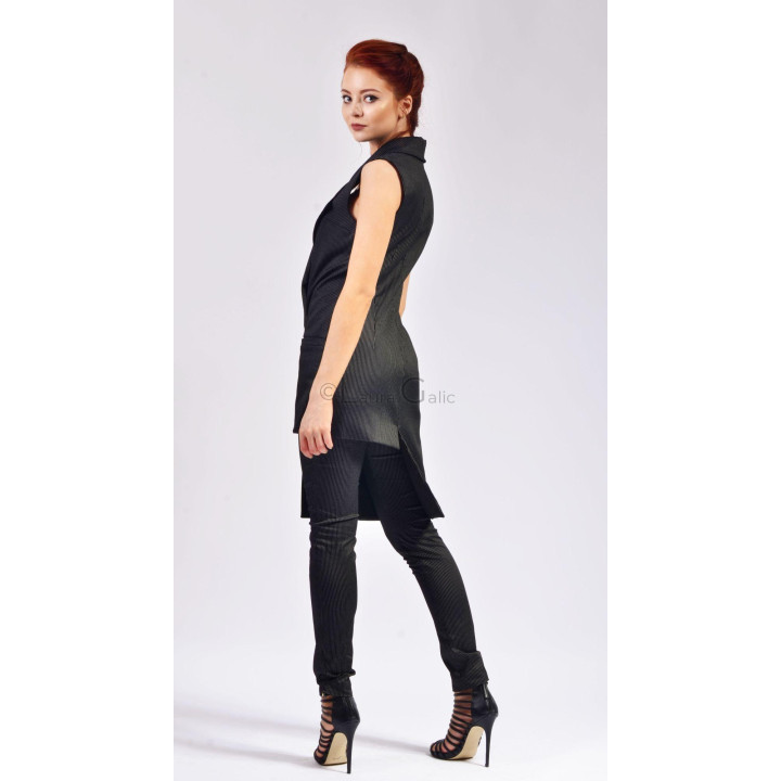 Side view of the sleeveless Melody vest with its extended asymmetric hem