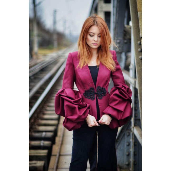 Olivia jacket with a deep V neckline and black decorative waist fastening