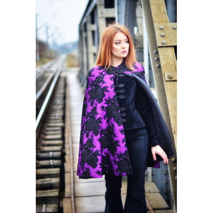 Uhura jacket-cape with a purple cape patterned with black flowers over a short black velvet jacket