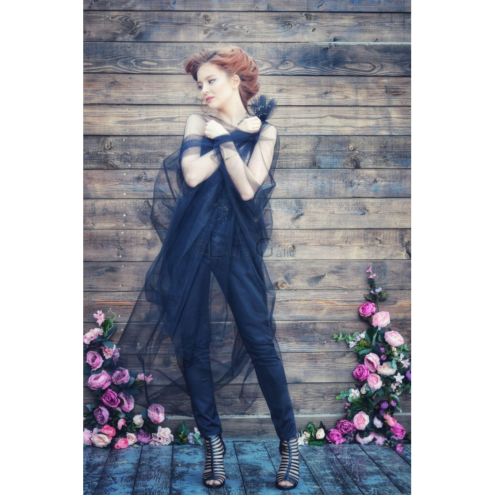 The Evolette corset partly covered by its flowing black tulle train