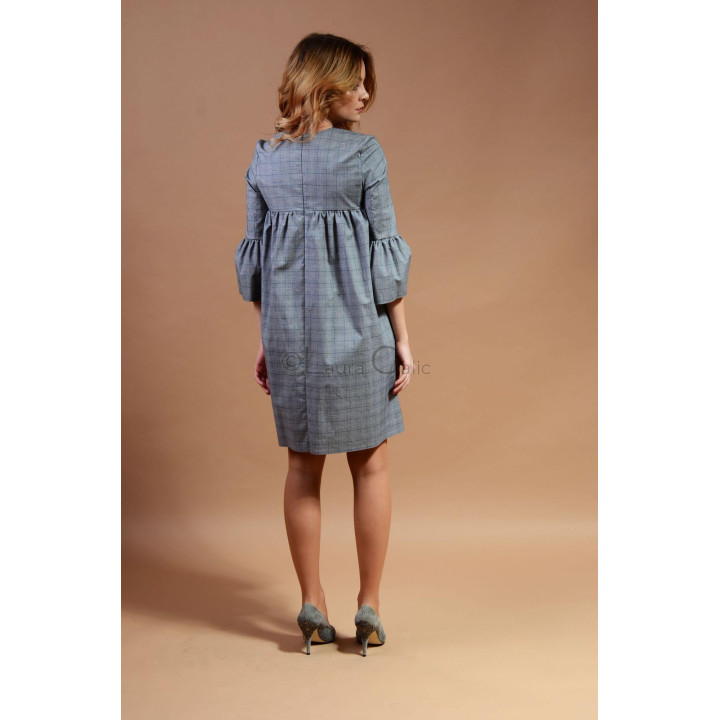 Back view of the Zola babydoll dress with a centre seam and gathered skirt