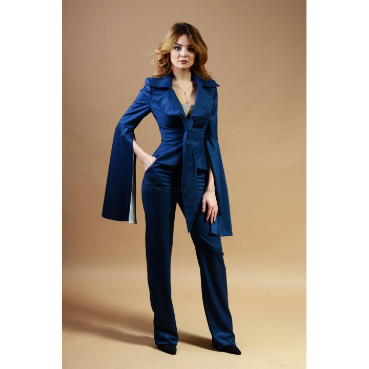 Close view of the wide lapels and open cape-style sleeves on the blue Jamila jacket