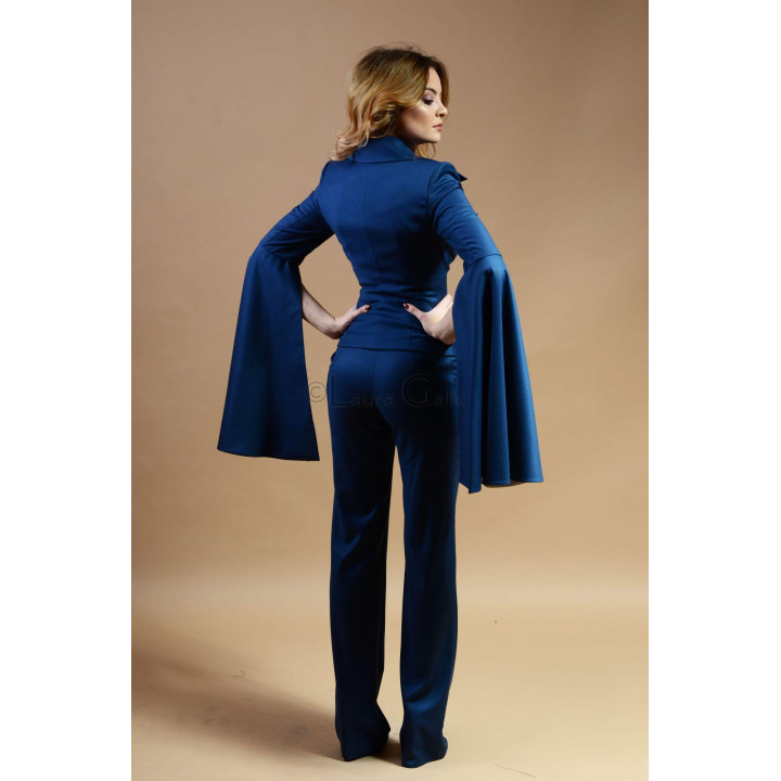 Back view of the Jamila suit with a fitted jacket and long sleeve panels