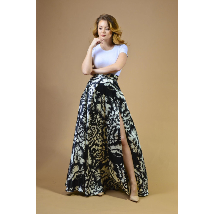 Hera long skirt with a black-and-white floral print and side slit, styled with a white top