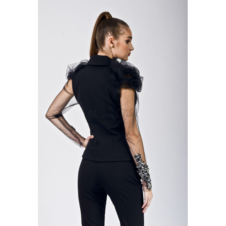 Back view of the Aurelia jacket with sheer sleeves and black trousers