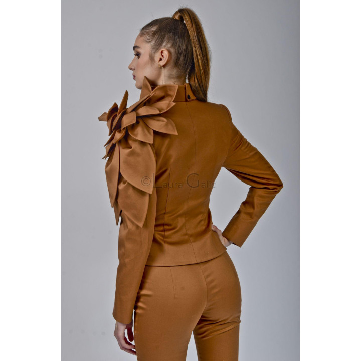 Back view of the Delia suit showing the fitted jacket and shoulder flower