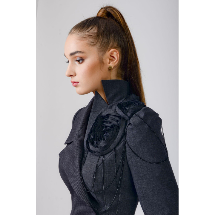 Close-up of the Izabela jacket's high collar, shoulder flower applique and black decorative chains
