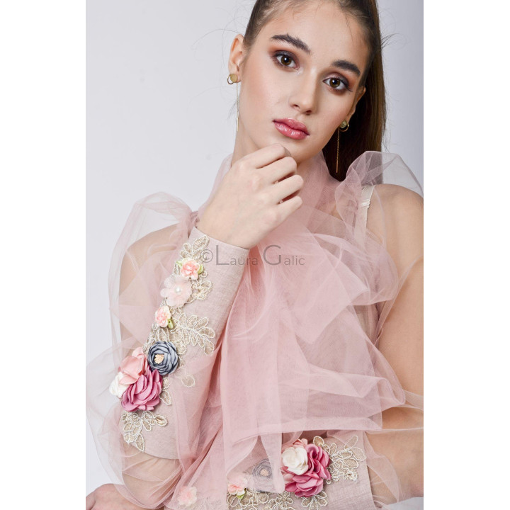 Close-up of the Tania blouse sleeve in tulle with floral appliqués on the cuff